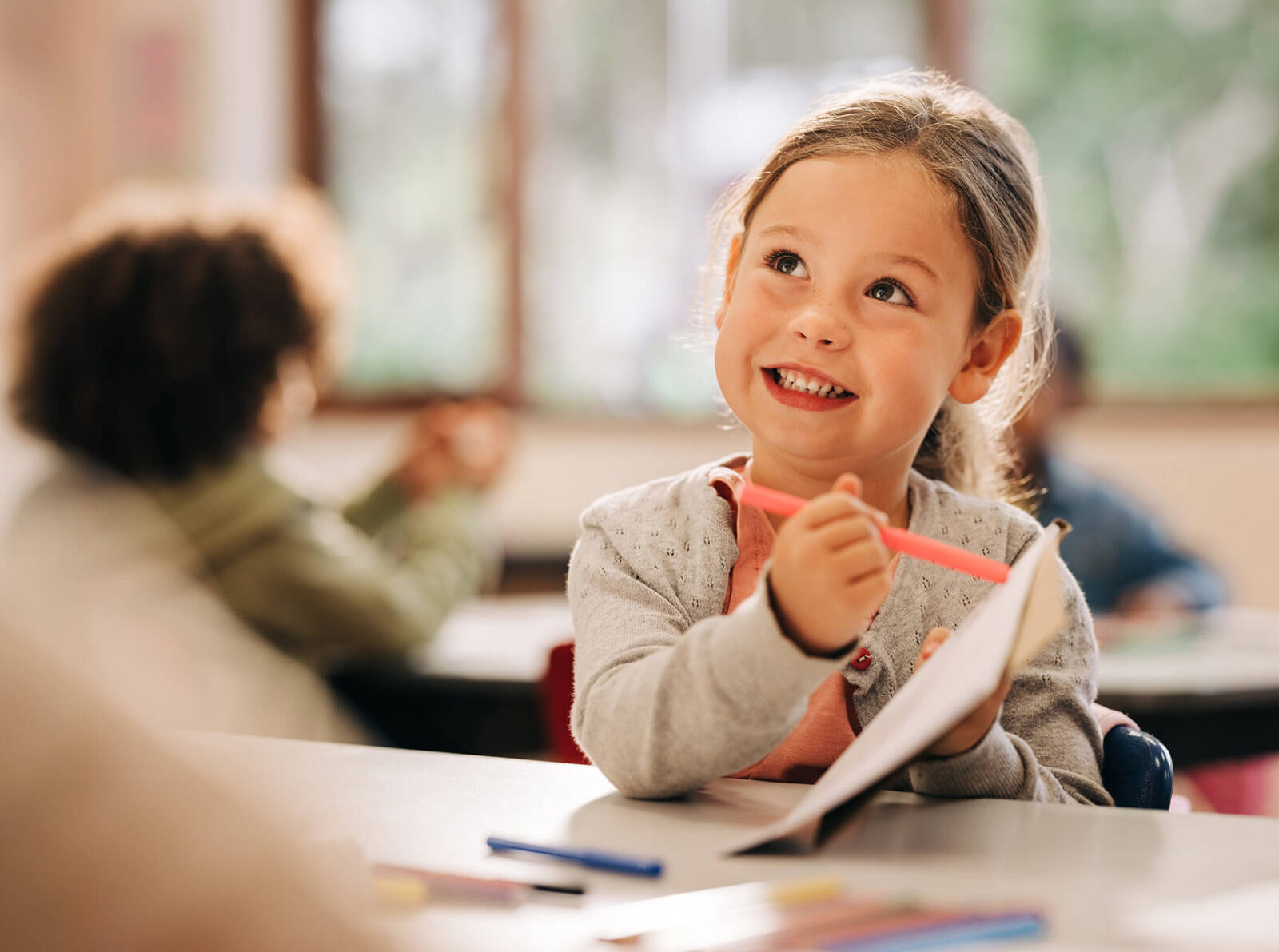 Smiling-Child-with-Paper